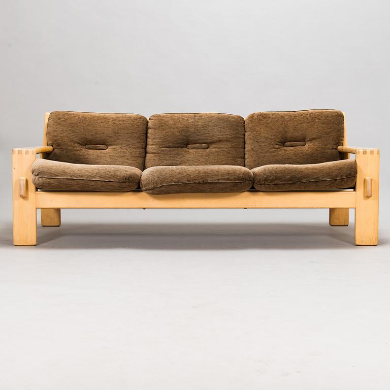 Esko Pajamies, A pair of 1970's 'Bonanza' armchairs, coffee table and sofa for Asko.