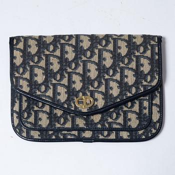 Christian Dior, a clutch and a scarf.