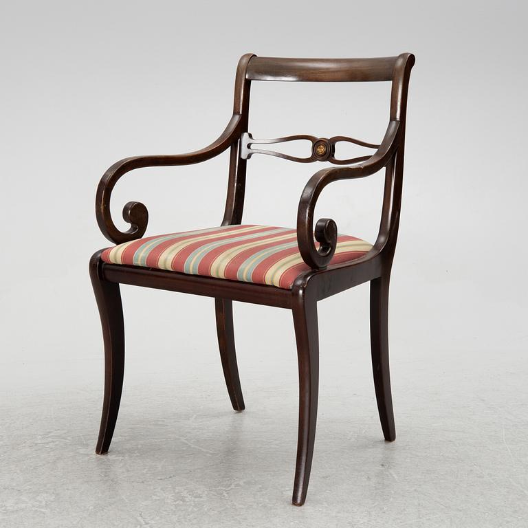 A mahogany veneer desk with desk chair, 20th Century.