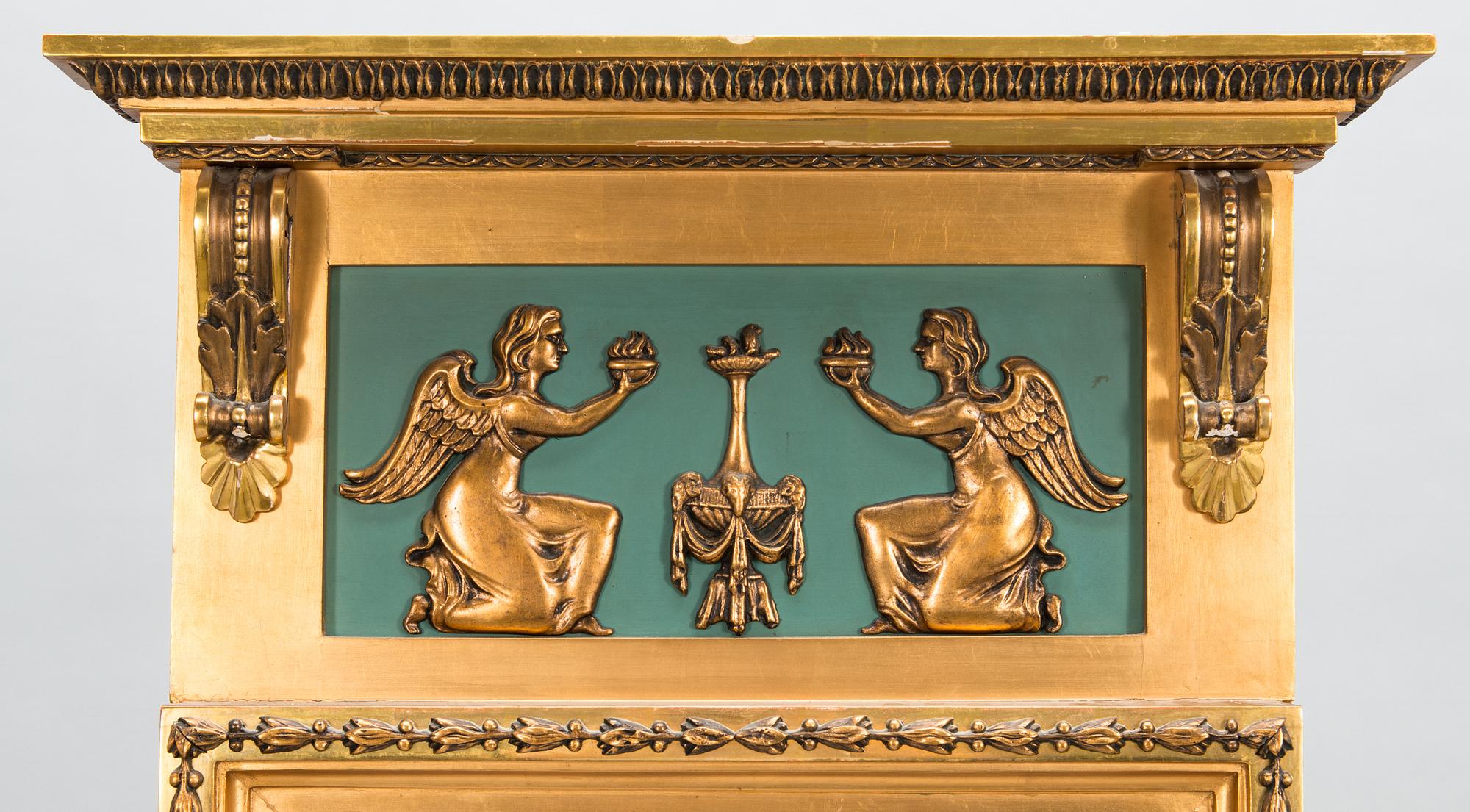 An early 20th century mirror with console table in late Gustavian style.