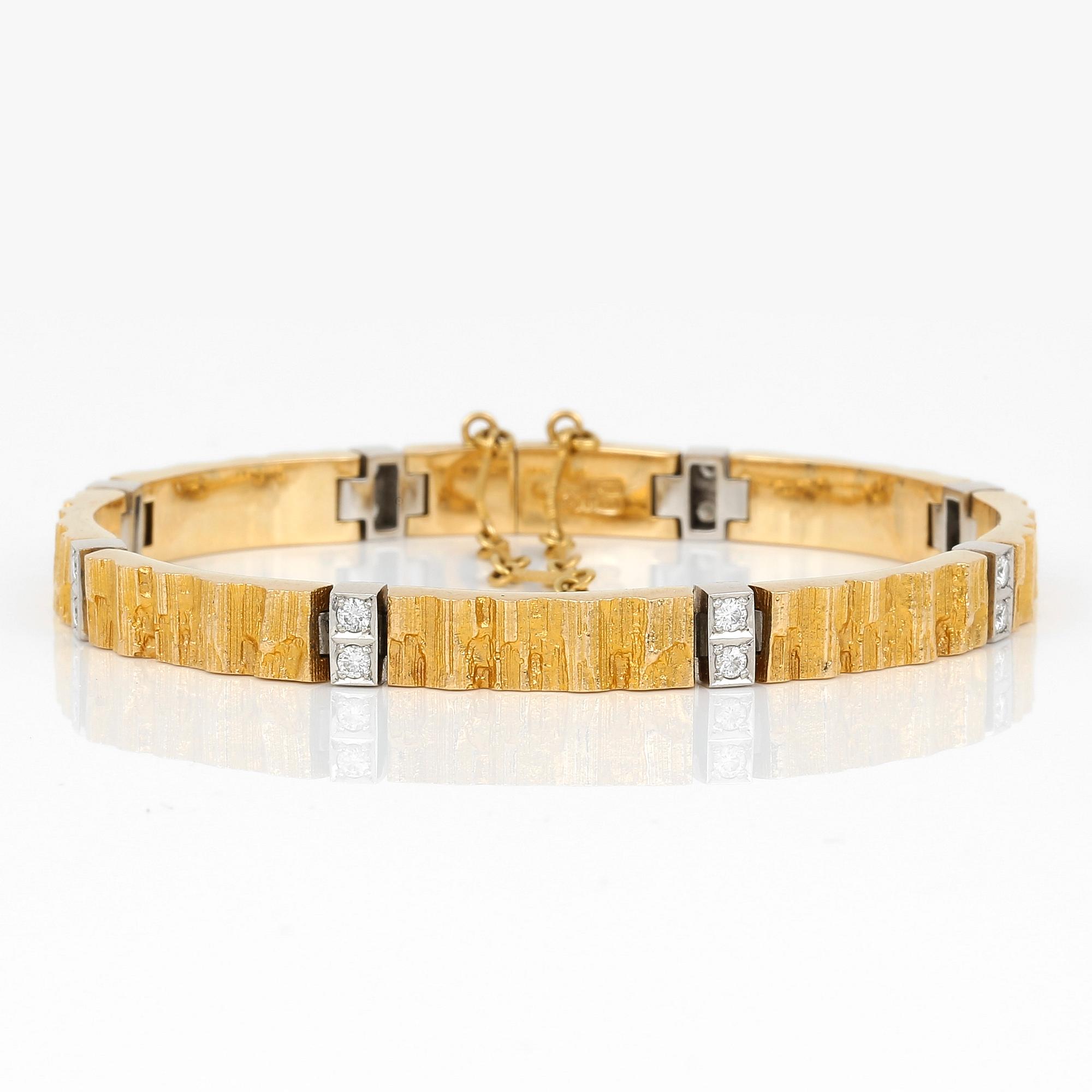 ARMBAND, 18K guld, 16 diamanter, Lapponia, 1984. Vikt ca 30g.