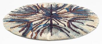 A knotted pile (rya) rug, diameter  180 - 190 cm.