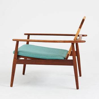 Hans Olsen, a model 519 teak easy chair for Juul Kristensen, Denmark, 1950's.
