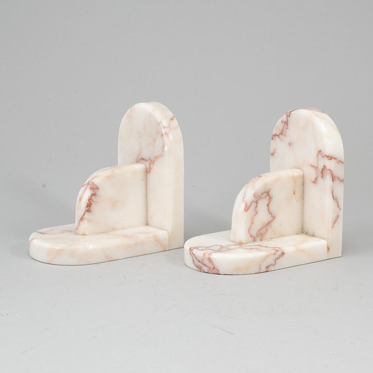 A pair of marble book ends, 20th century.