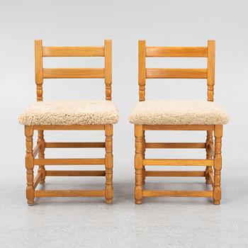 A set of eight pine chairs with new sheepskin upholstery, 1970s.