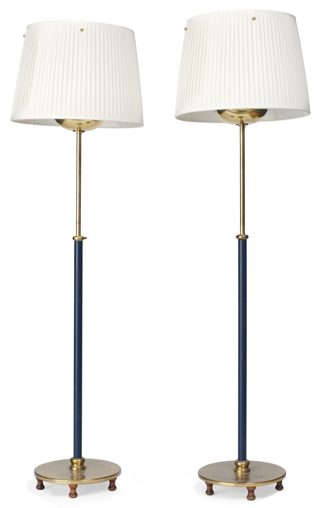A pair of Josef Frank brass, partly lacquered in blue, floor lamps, Firma Svenskt Tenn.