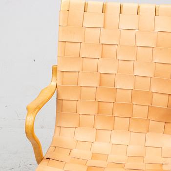 An 'Eva' easy chair by Bruno Mathsson for Firma Karl Mathsson dated 1971.