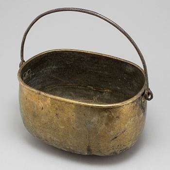 An 18th century brass cauldron.