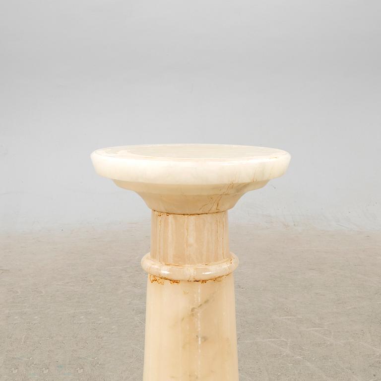 An alabaster pedestal later part of the 20th century.