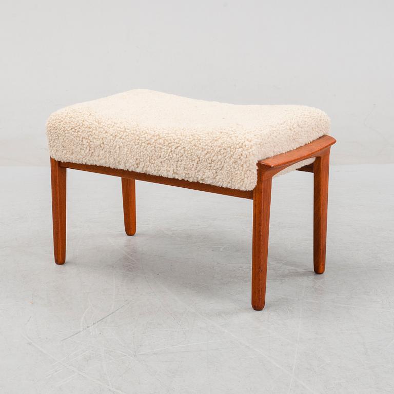 A Danish mid 20th Century sheepskin upholstered ottoman.