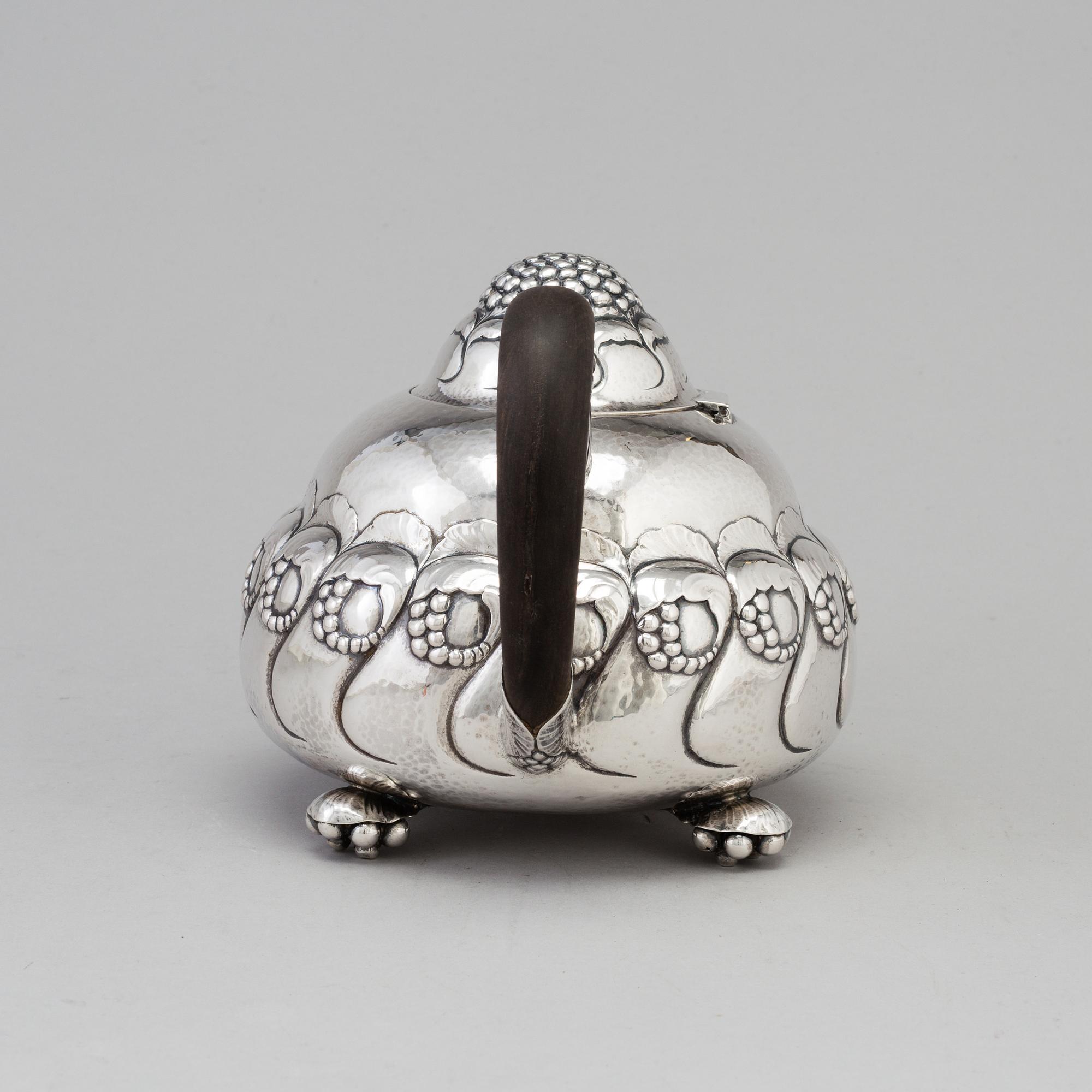 A Danish Art Nouveau silver teapot, maker's mark EVALD NIELSEN, Copenhagen, 1919.