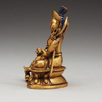 A Sino-Tibetan gilt bronze figure of Kubera, 18th Century.