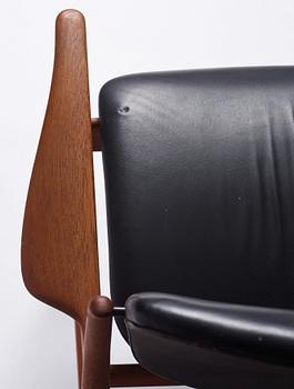 Finn Juhl, a teak and black leather 'model 136' easy chair, France & Daverkosen, Denmark 1950-60s.