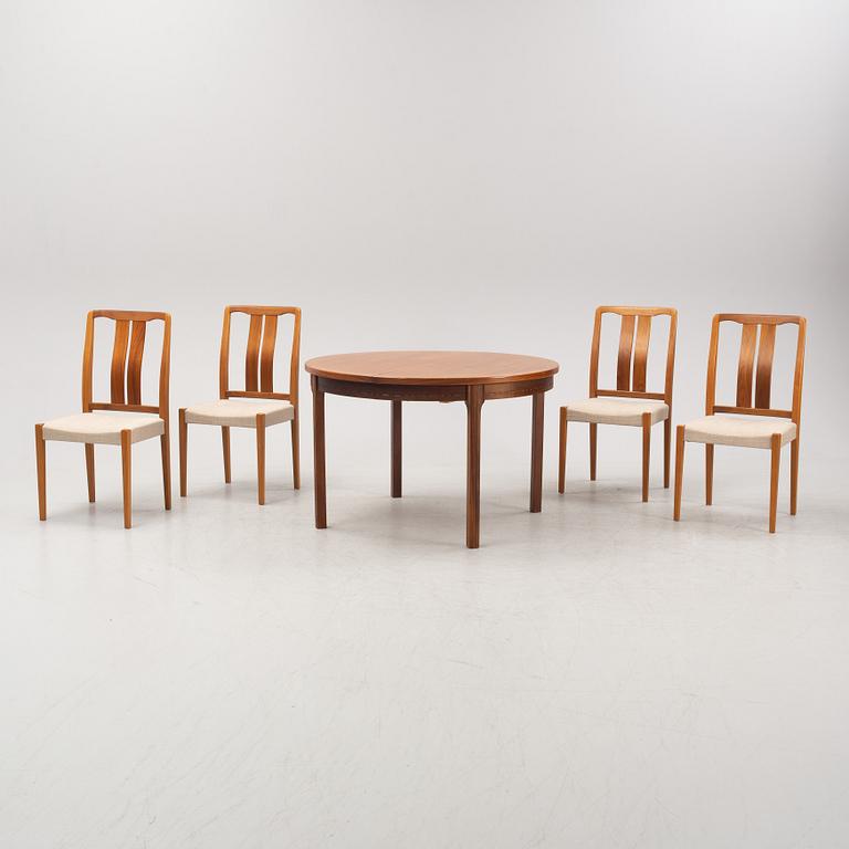 A 'Rimbo' walnut dining table and four chairs, second half of the 20th Century.