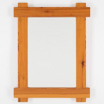 A 1980's pine mirror.