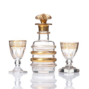 A set of Russian glasses (13 pcs.) and a bottle with stopper, 19th Century.