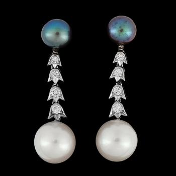 1165. A pair of cultured pearl and diamond app. tot. 0.40 ct earrings.