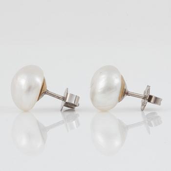 A pair of probably natural pearl earrings.