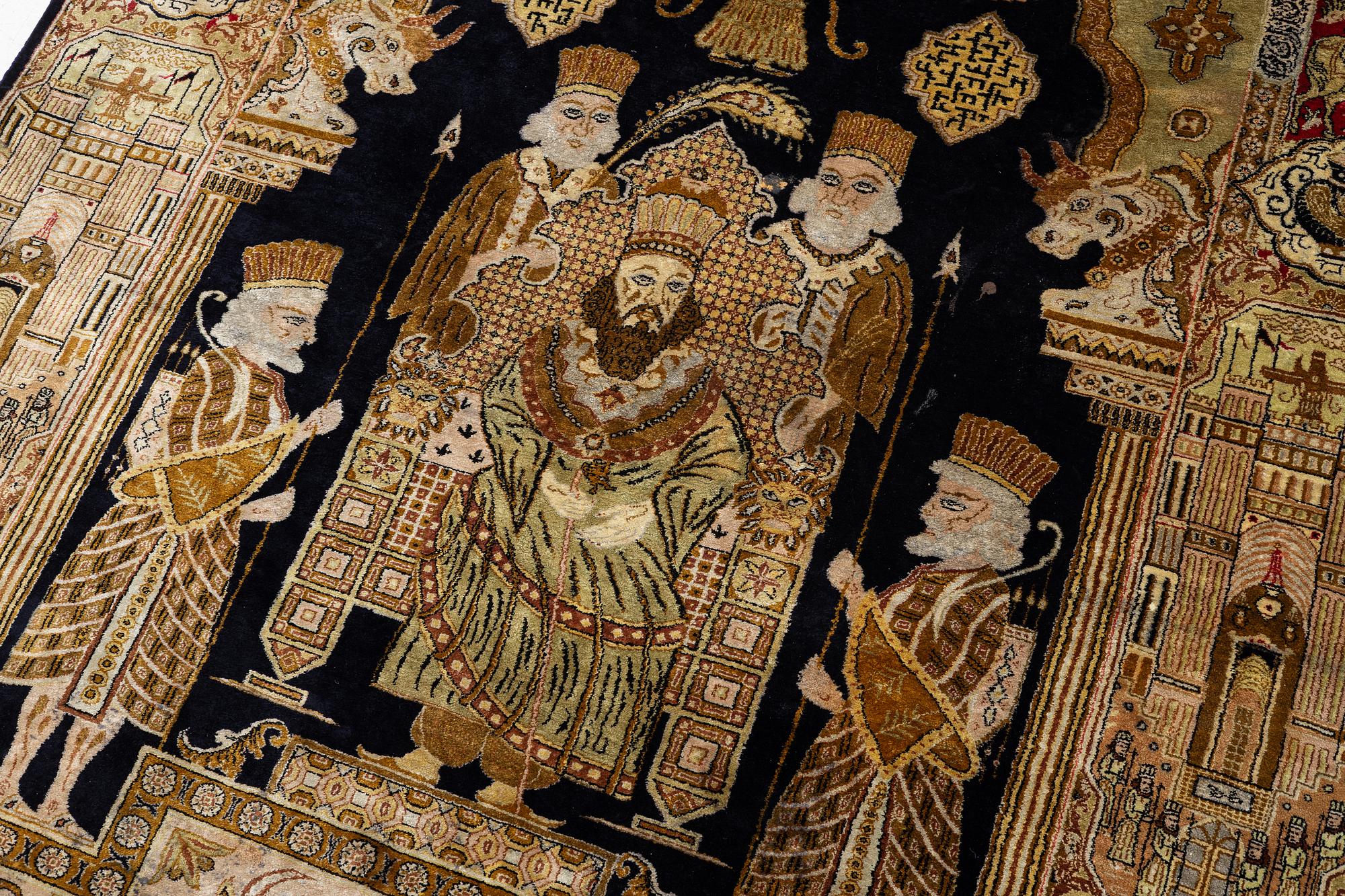 A pictorial semi-antique silk Qum rug, central Persia, c. 214 x 146 cm.