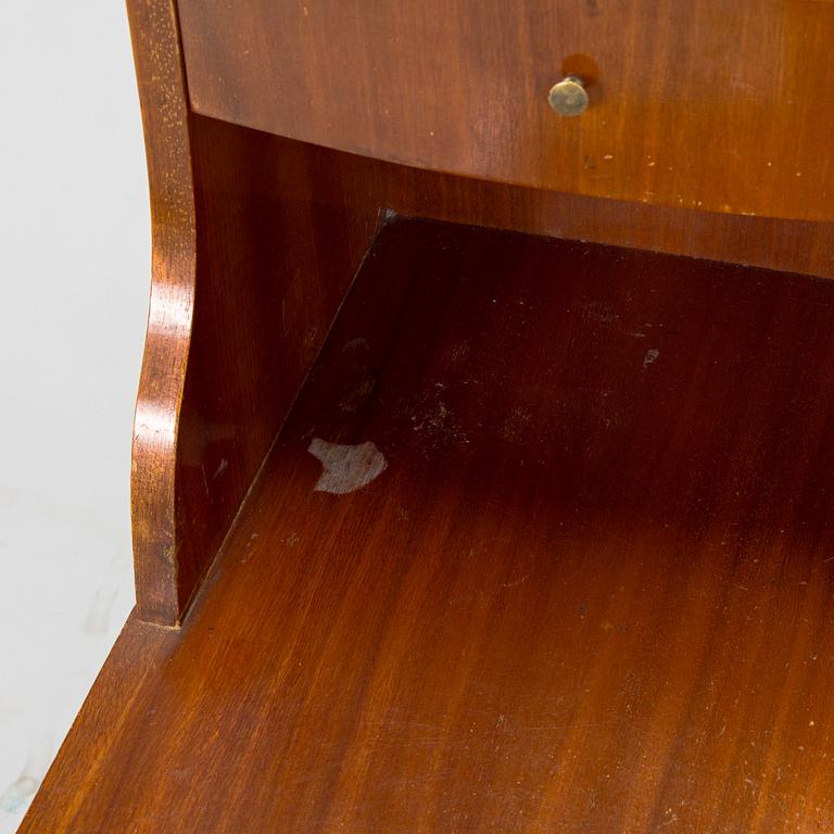 A pair of 20th century bedside tables.