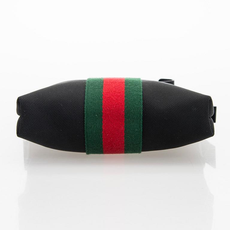 Gucci, a "Techno Canvas Web Messenger" bag.