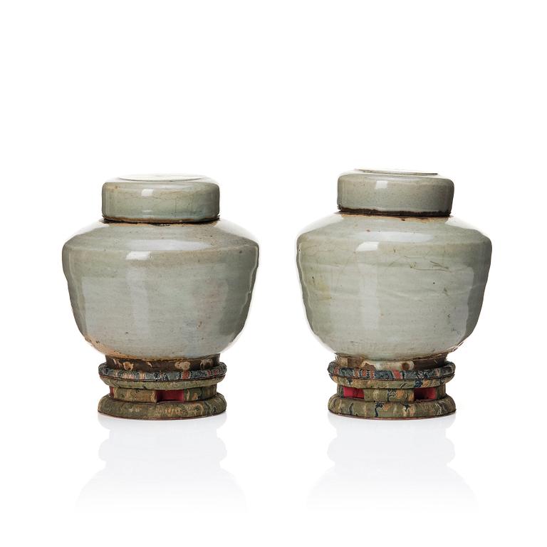 A pair of Japanese celadon jars with cover, Edo period (1603-1868).