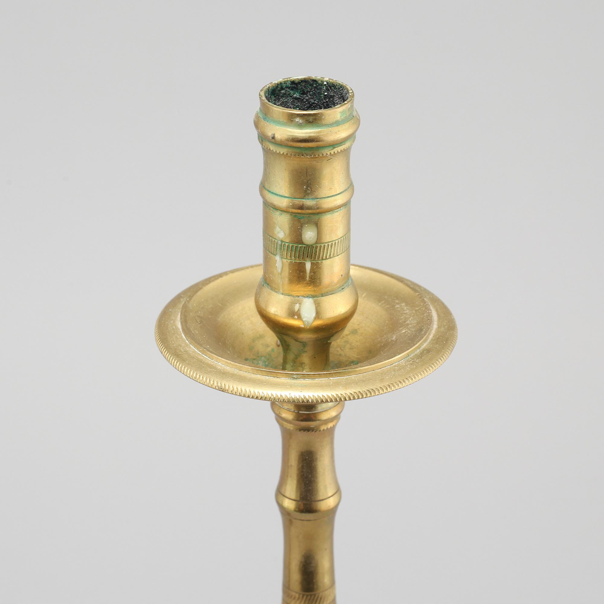A pair of brass candlesticks, made around year 1900.
