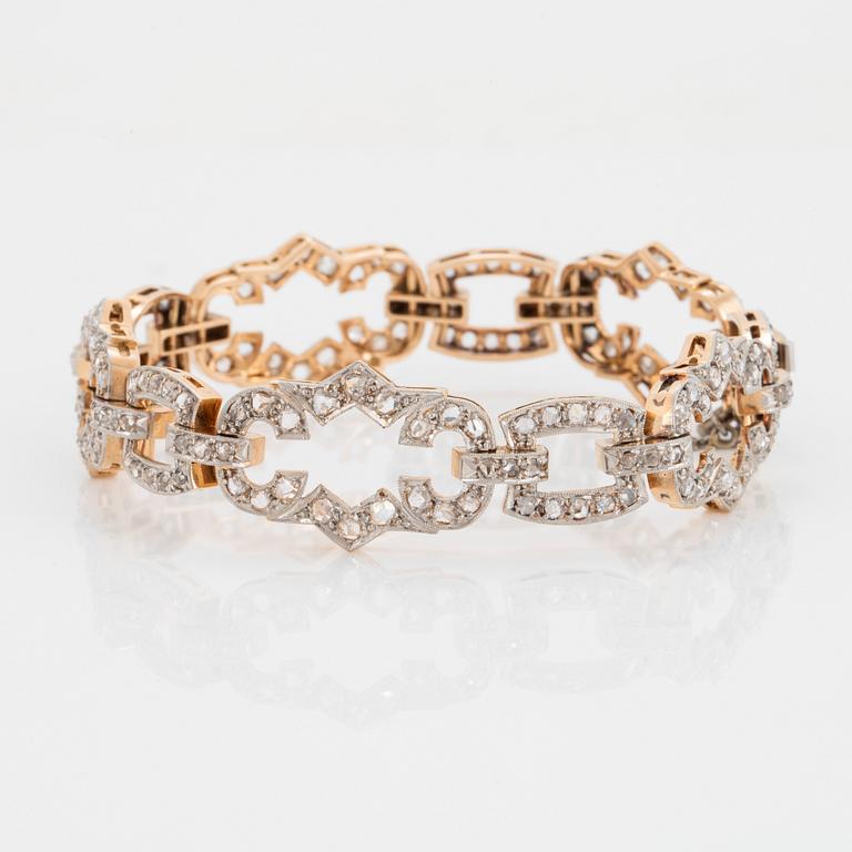 A 14K gold and platinum bracelet set with rose-cut diamonds.