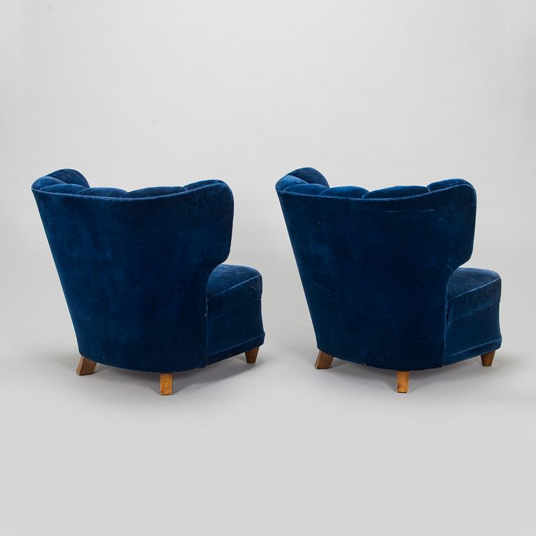 A pair of mid-20th century armchairs.