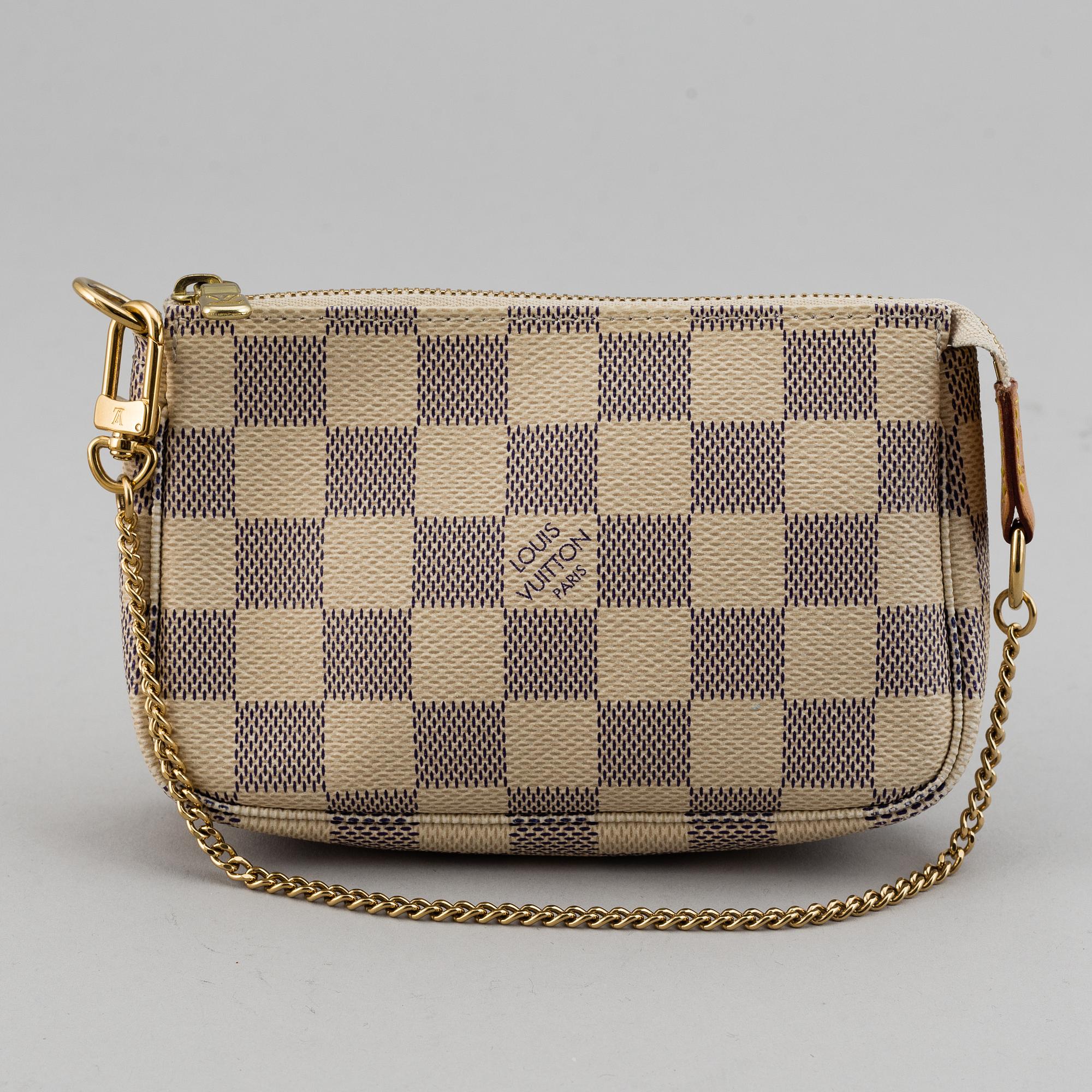 LOUIS VUITTON, A 'Mini Pochette Accessoires' and a shoulder strap.