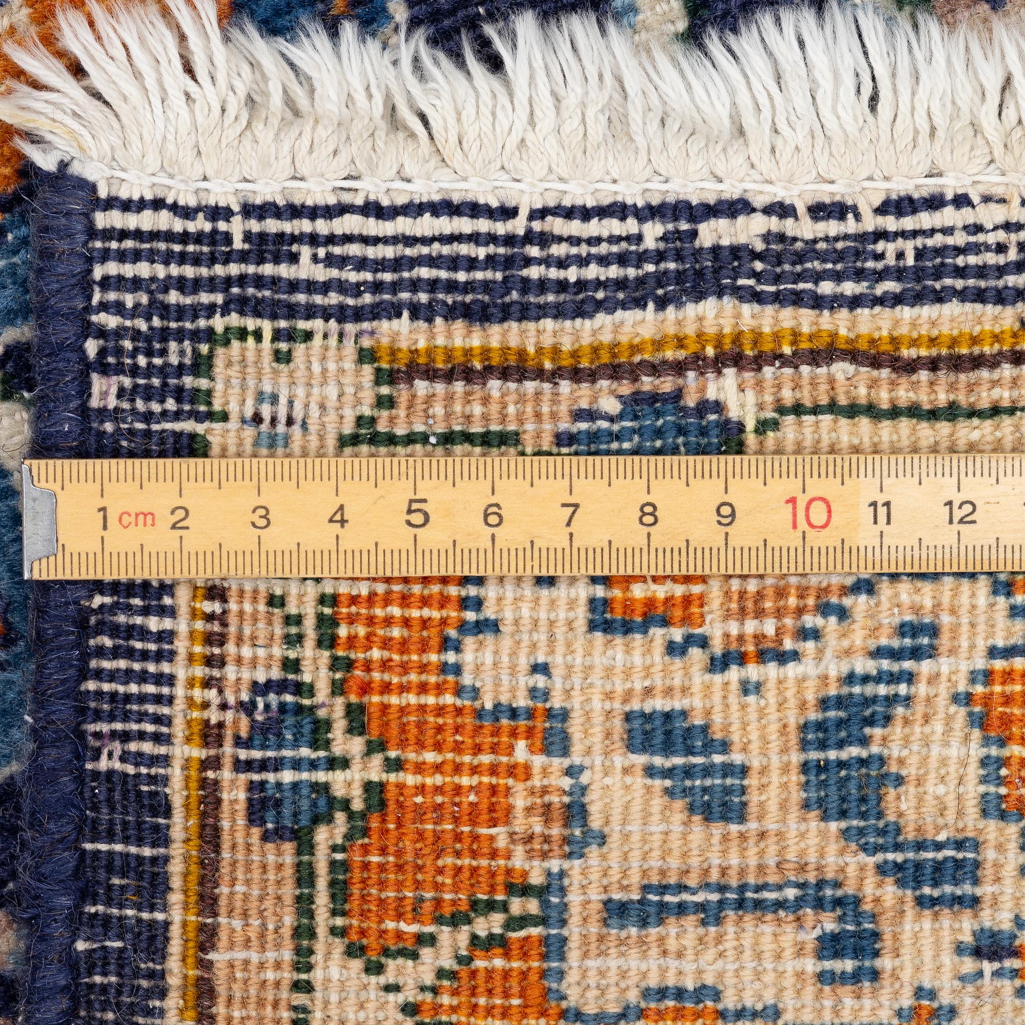 A Kashmar carpet, c. 335 x 242 cm.