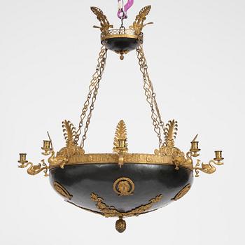 A presumably Russian Empire gilt and patinated bronze nine-branch chandelier, 19th century.