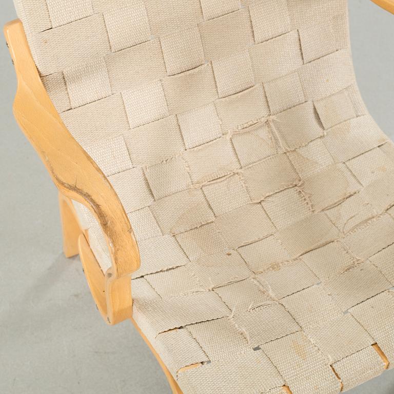 An "Eva" armchair, designed by Bruno Mathsson for Dux,