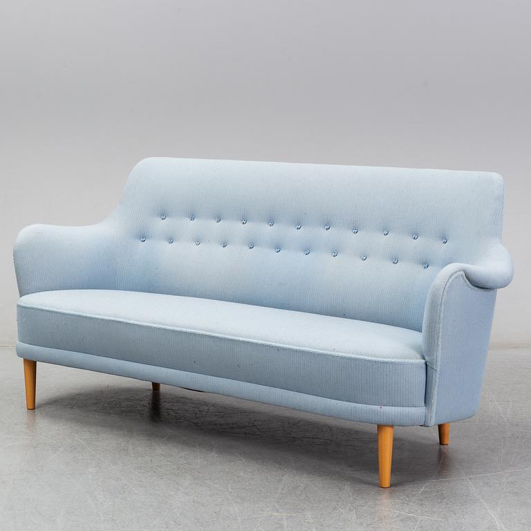 A 'Samsas' sofa and easy chair by Carl Malmsten dared 1985.