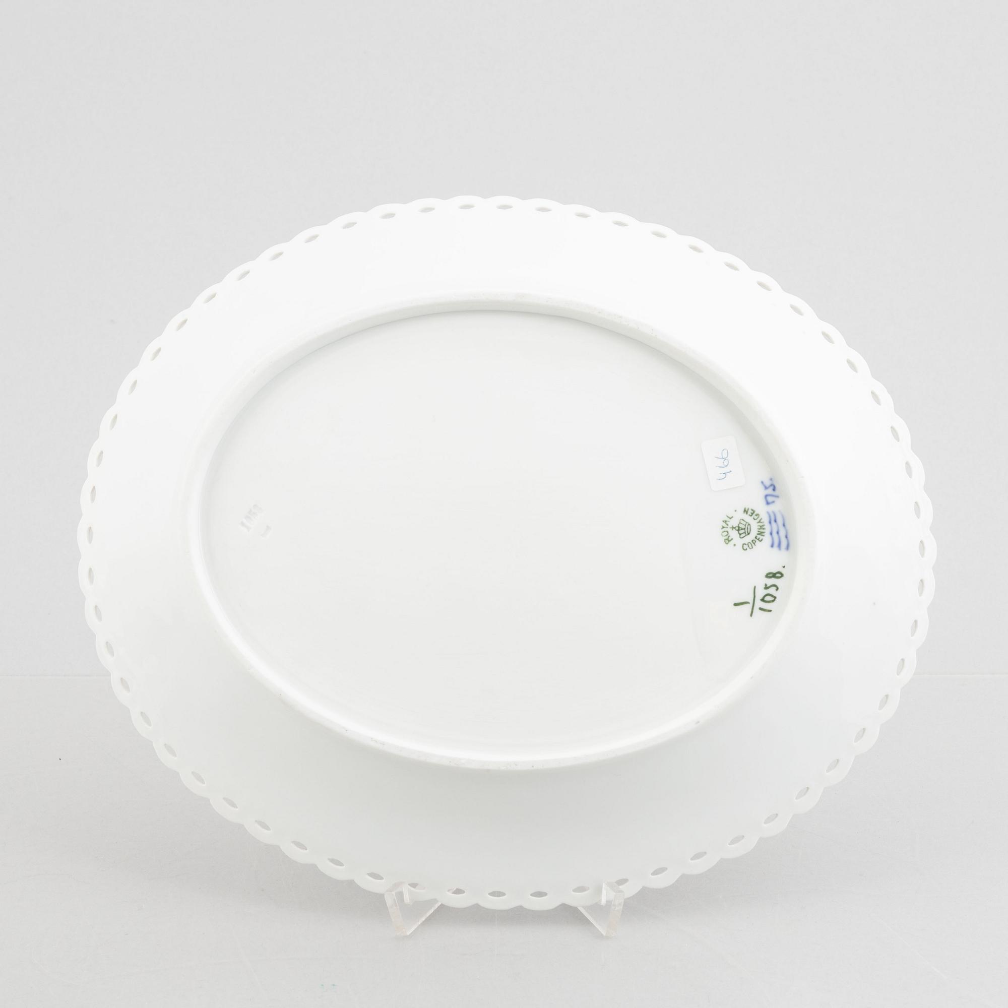A Royal Copenhagen 'musselmalet full lace' chesnut basket with stand, (1889-1922). 1057.
