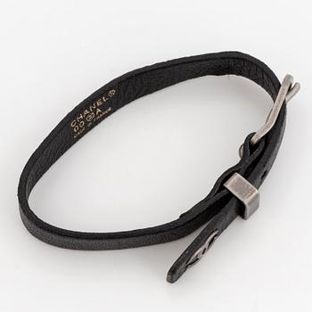 CHANEL, a leather bracelet.