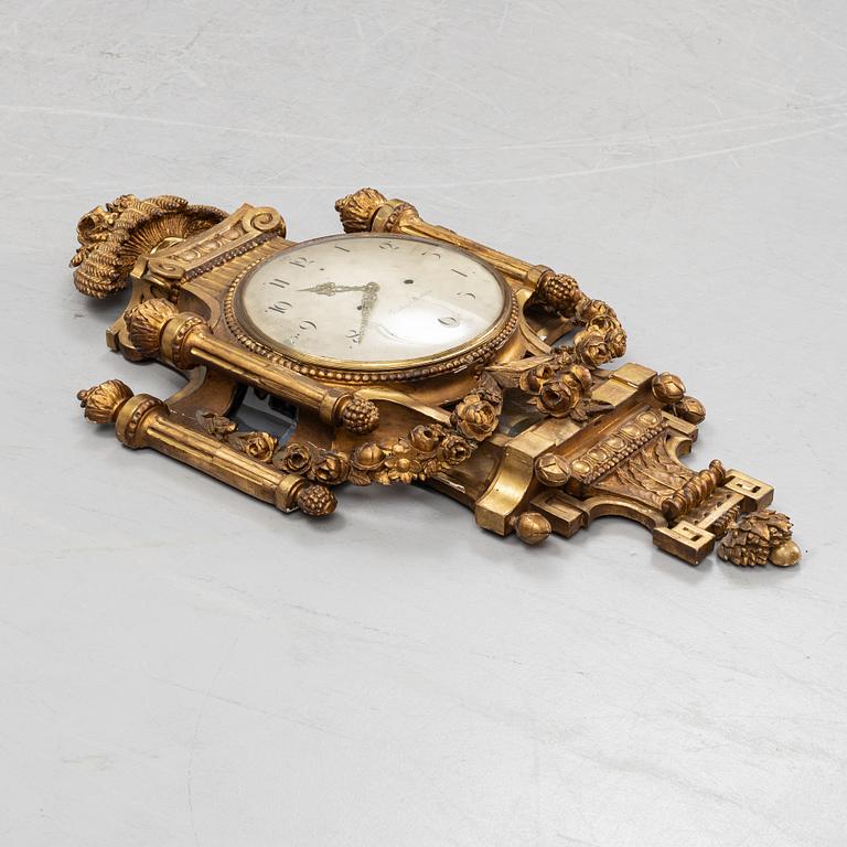 A Gustavian giltwood and parcel-gitl cartel clock by Per Henrik Beurling (Stockholm 1783-1806).