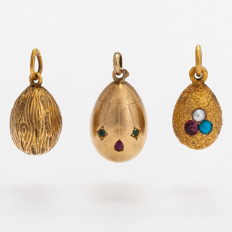 A collection of 24 egg pendants in original wooden box, Russia, early 20th century.