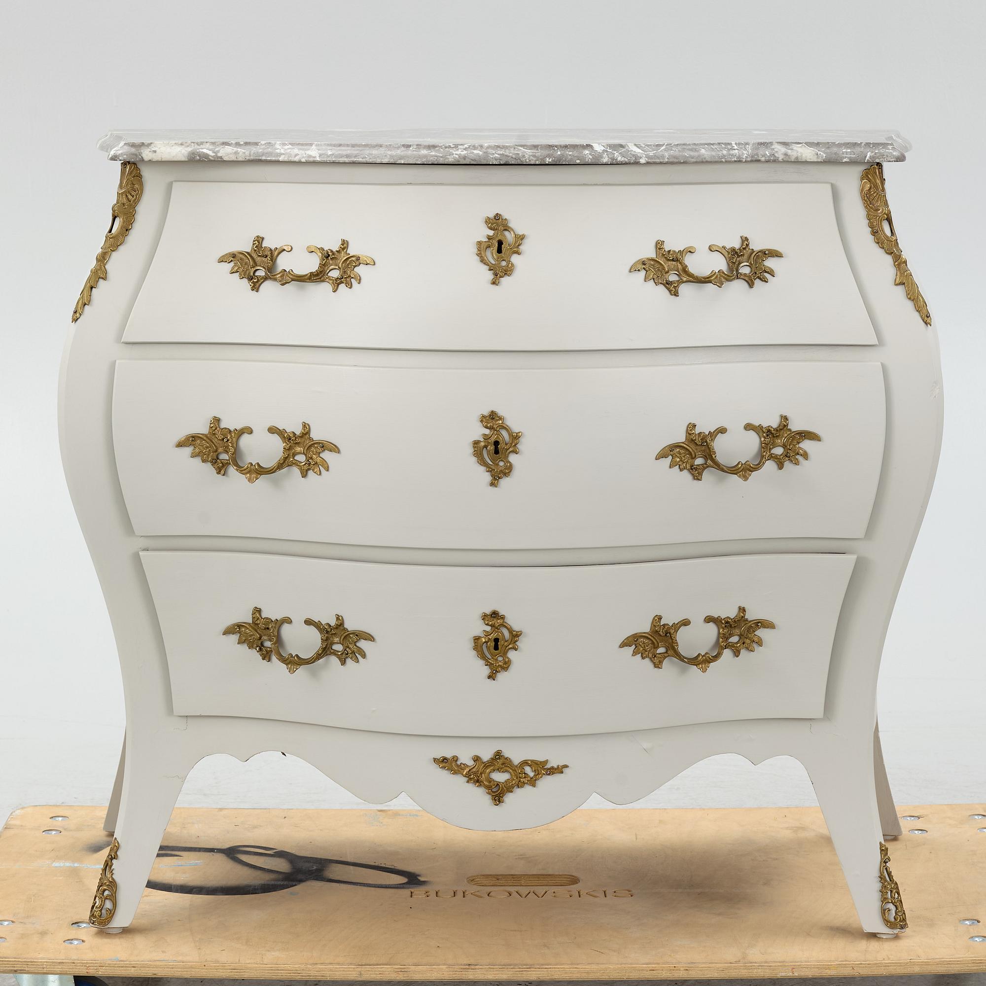 A Rococo style chest of drawers, mid-20th Century.