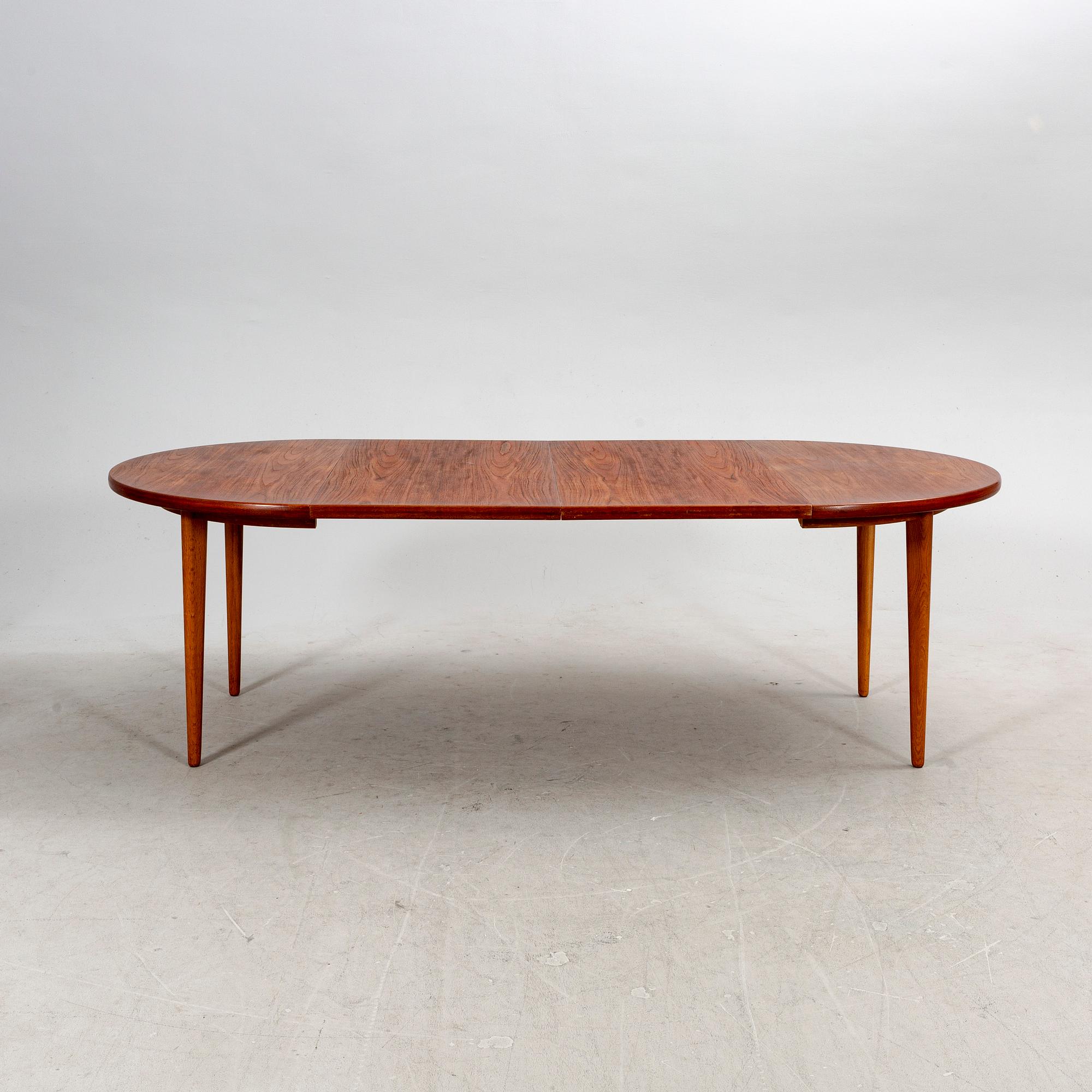 A mid 1900s fice pcs teak dining set.