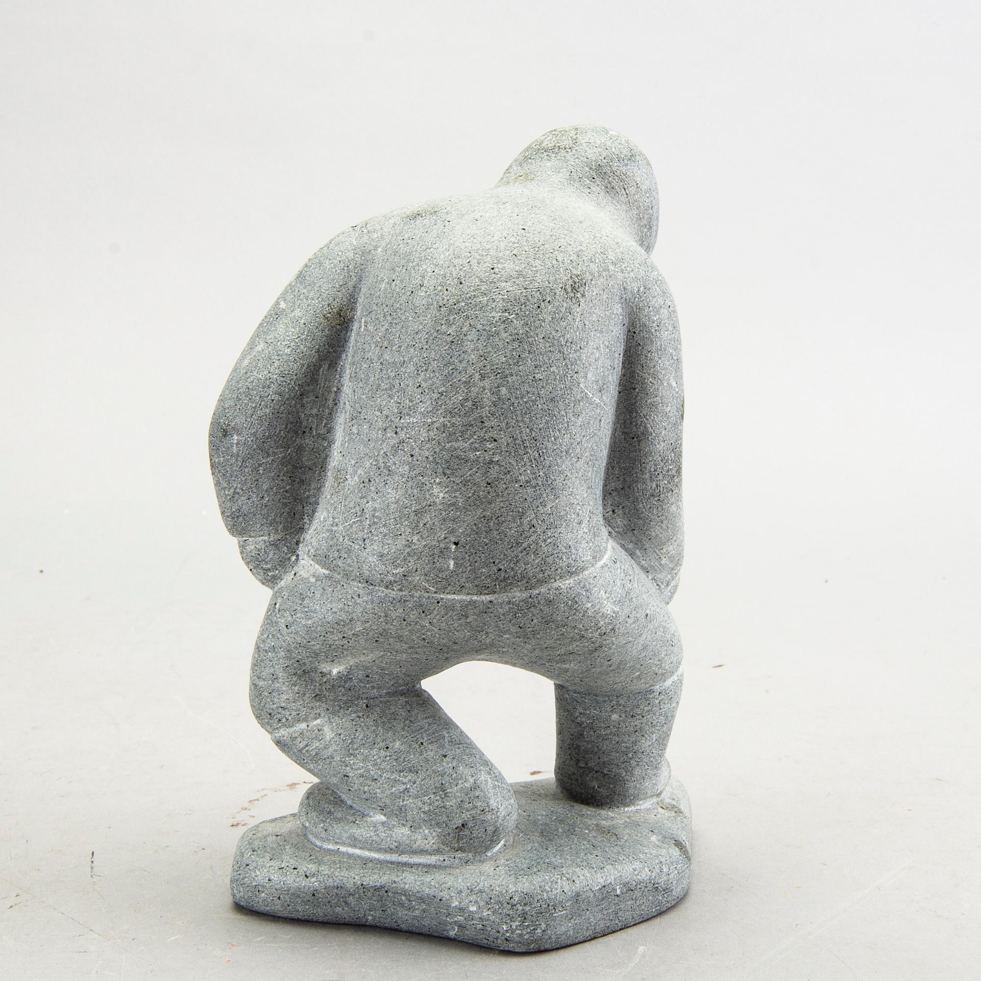 A simon Kristofferson signed stone figurine.
