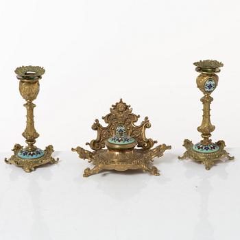 A pair candlesticks and an inkwell, circa 1900.