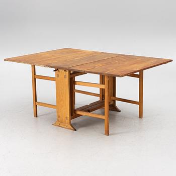 A drop-leaf table, 19th Century.