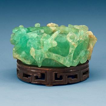 1642. A Chinese green stone brush pot, first part of 20th Century.