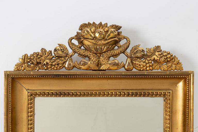 A pair of Empire giltwood two-branch girandole mirrors, Sweden, first part 19th century.