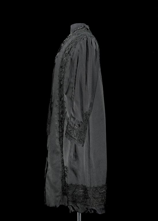 A late 19th cent black silk evening gown.
