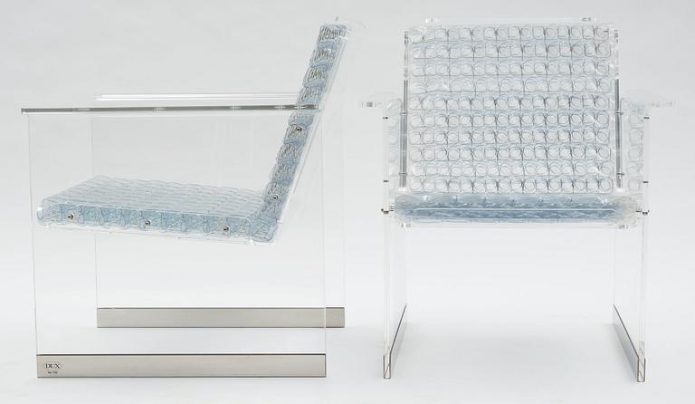 A pair of Arne Rickardt armchairs, 'Pascal', Dux 2002.