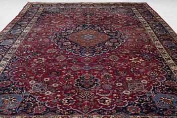 A semi-antique Mashad carpet, Eastern Iran, signed c. 507 x 303 cm.