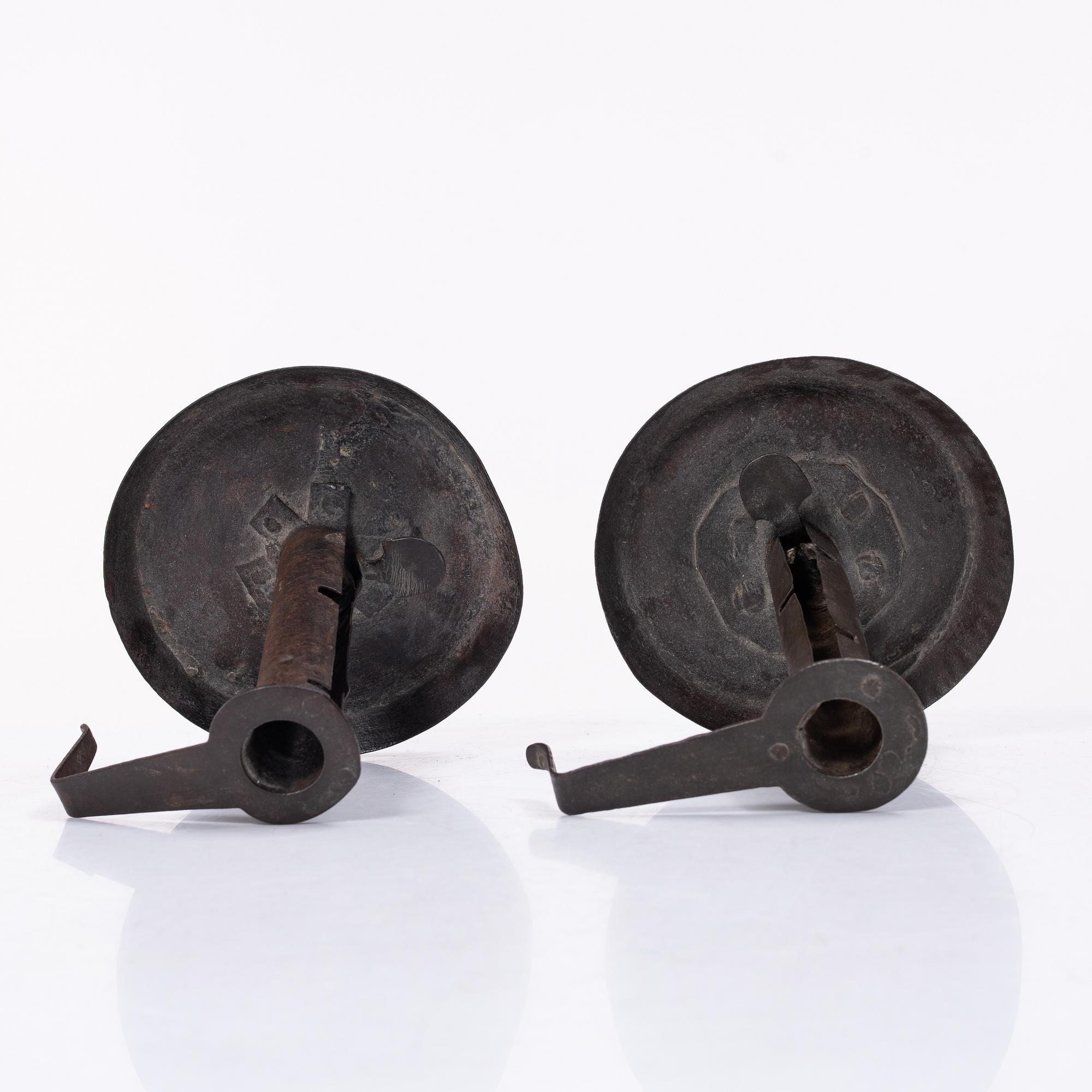 A pair of similar candle holders, 19th century.