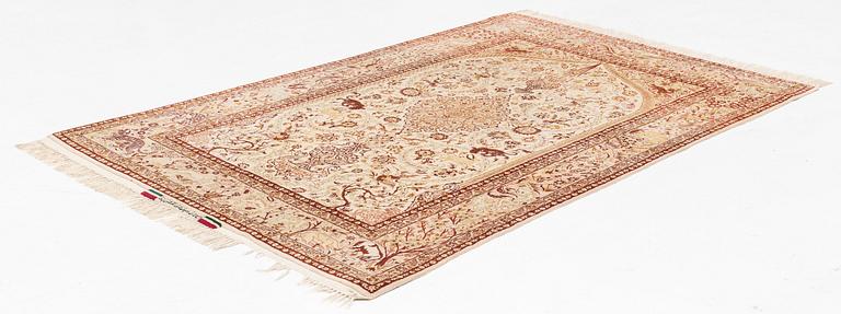 A signed part silk Esfahan rug, ca 233 x 147 cm (as well as 3 cm flat weave on each side).